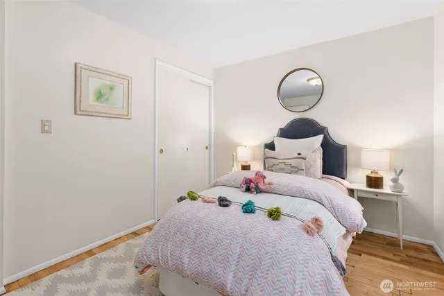 a bedroom with bed and a window