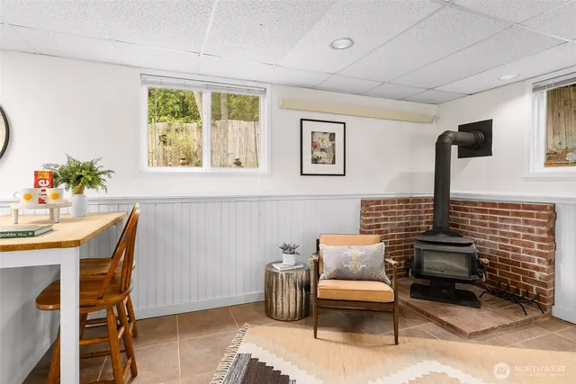 a bedroom with furniture and a potted plant