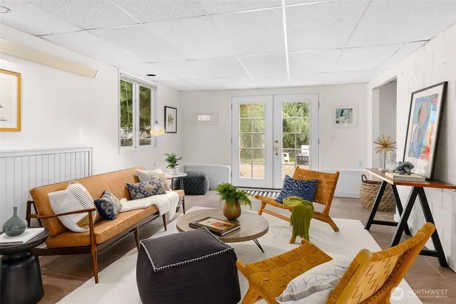a living room with furniture and a large window