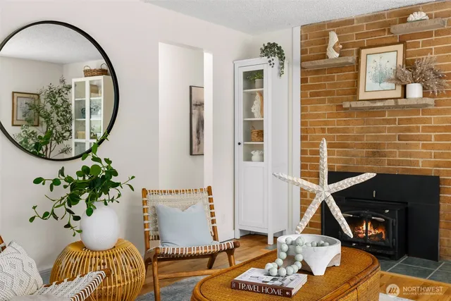 a living room with furniture and a mirror