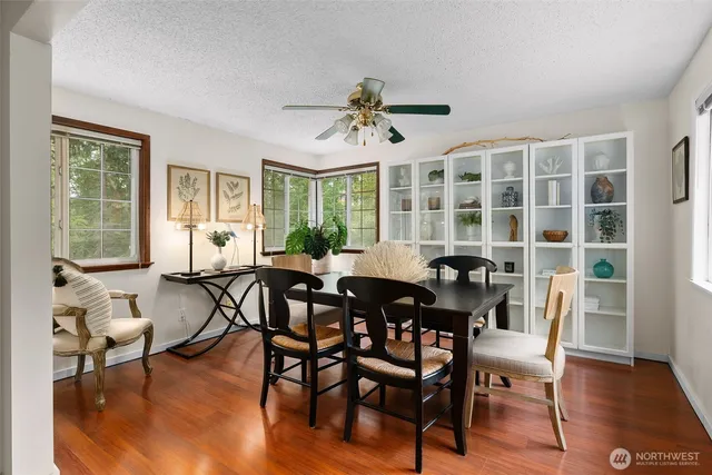 a view of a dining room with furniture window and outside view