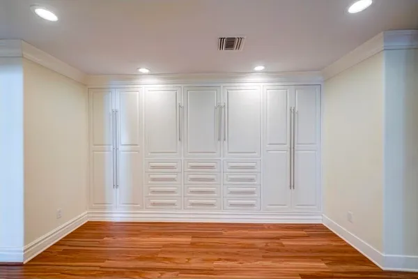 a view of an entryway with wooden floor
