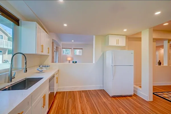 a view of a dining room with furniture and wooden floor