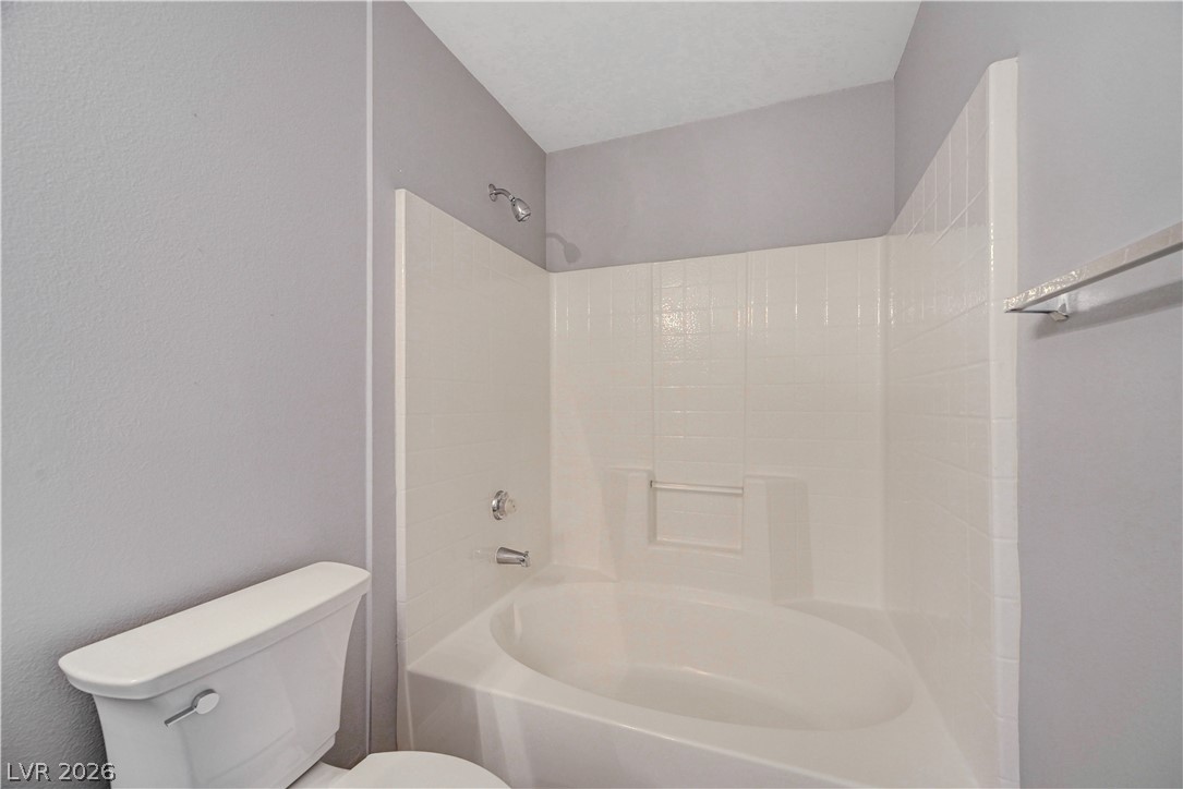 3425 East Russell Road, Unit 223 Las Vegas, NV 89120 - Photo 24 of 47 A well-maintained bathroom with a sleek white bathtub and shower combination.