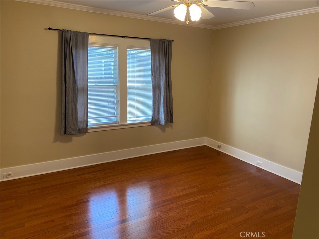 491 Eldora Road Pasadena, CA 91104 - Photo 11 of 14 an empty room with wooden floor and windows