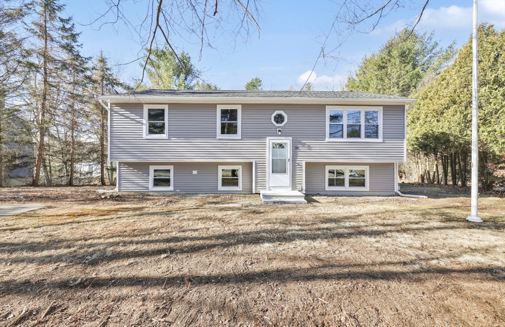 33 Brimfield Road Holland, MA 01521 - Photo 1 of 27 a front view of a house with a yard