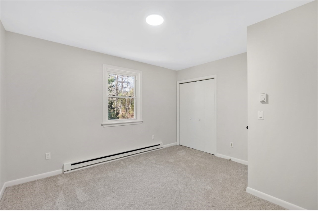 33 Brimfield Road Holland, MA 01521 - Photo 14 of 27 a view of an empty room with a window