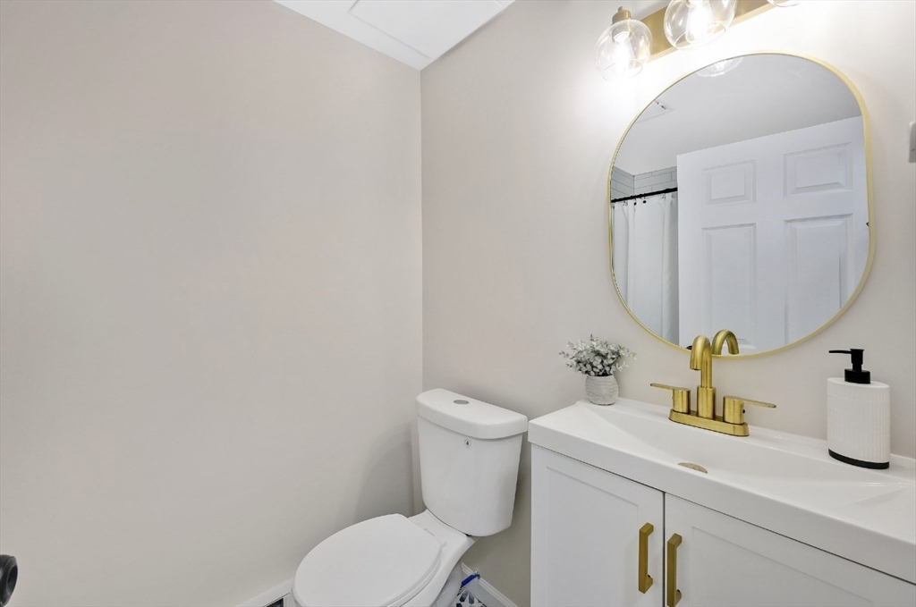 33 Brimfield Road Holland, MA 01521 - Photo 20 of 27 a bathroom with a toilet sink and mirror