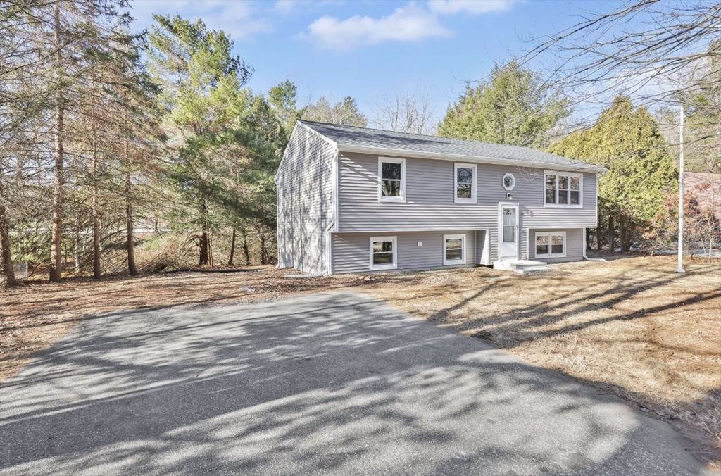 33 Brimfield Road Holland, MA 01521 - Photo 3 of 27 a front view of a house with a yard