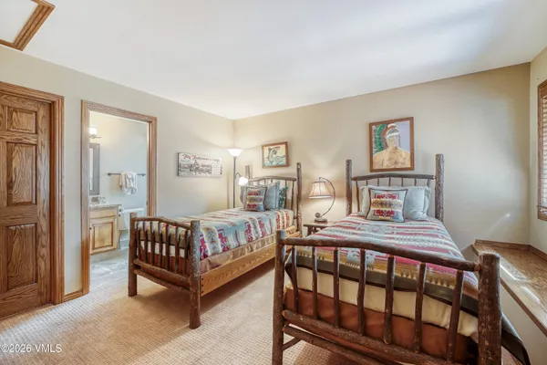 a bedroom with a bed and a table