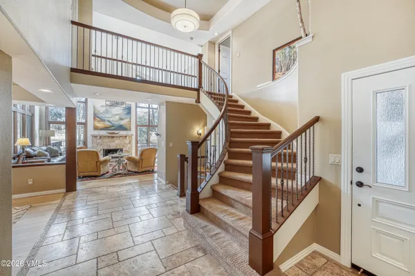 a view of staircase with white walls and windows