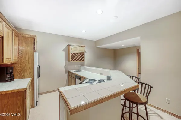 a bedroom with a bed and a table