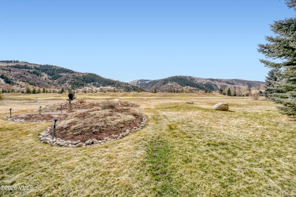 a view of an ocean and a mountain