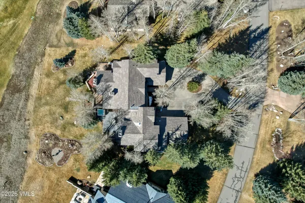 an aerial view of a house with a yard