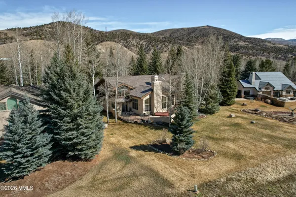 a view of a town with mountains in the background