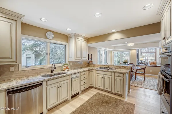 a kitchen with a sink and cabinets