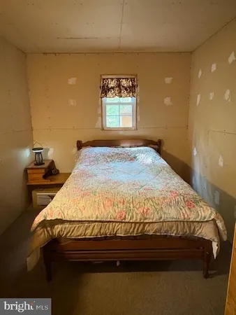 a living room with a bed