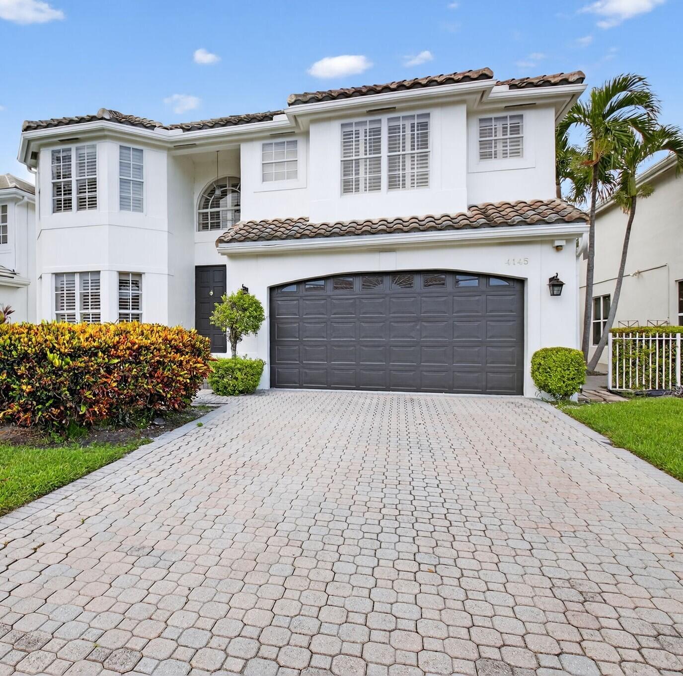 4145 Northwest 58th Lane Boca Raton, FL 33496 - Photo 2 of 48 Front