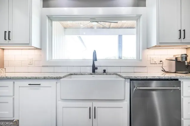 a kitchen with a sink and a window