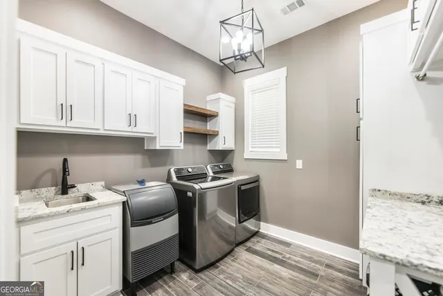 a living room with a bed furniture and a window