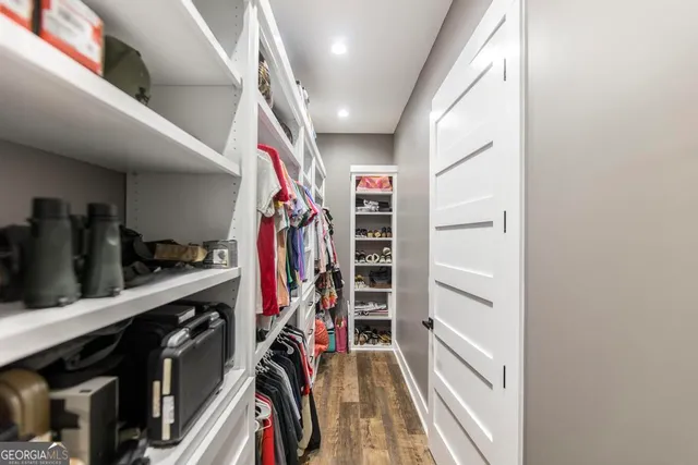 a living room with a bed furniture and a window