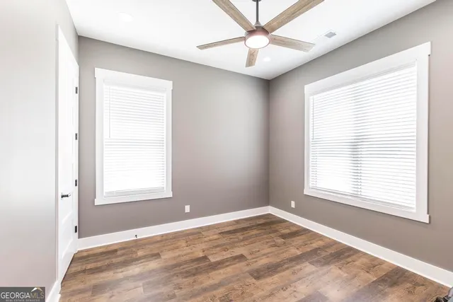 a bedroom with bed and a window