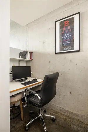 a view of a workspace with furniture