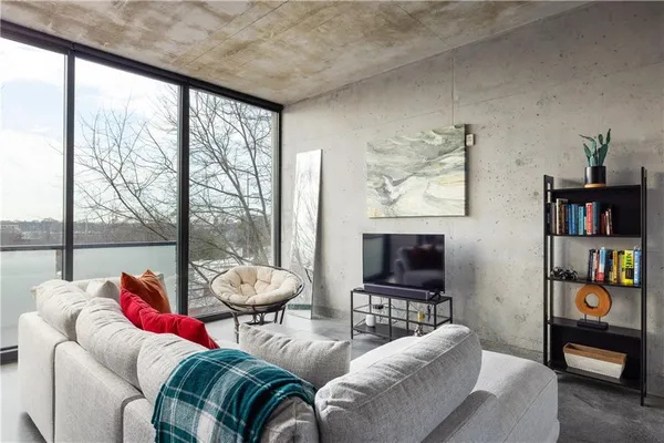 a living room with furniture and a flat screen tv