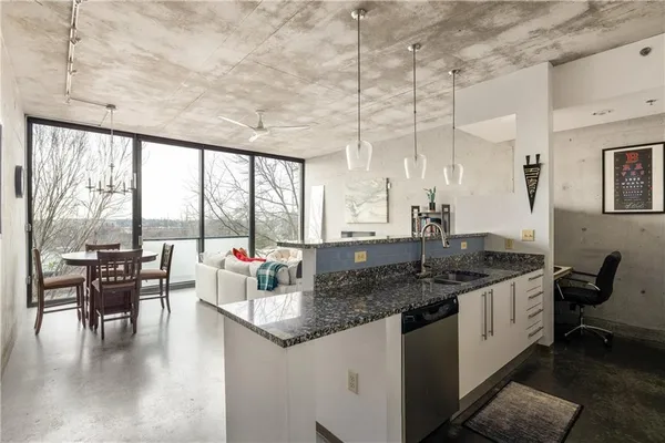a very nice looking kitchen with a large window