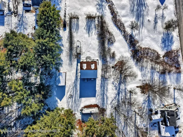 an aerial view of residential house and green space