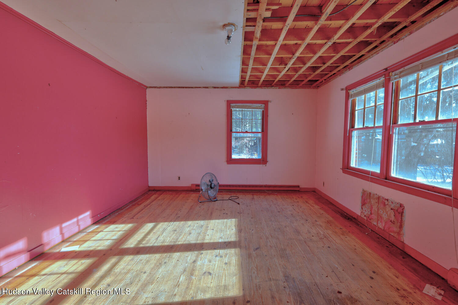42 Old Rte 23 Cairo, NY 12413 - Photo 25 of 69 an empty room with wooden floor and windows