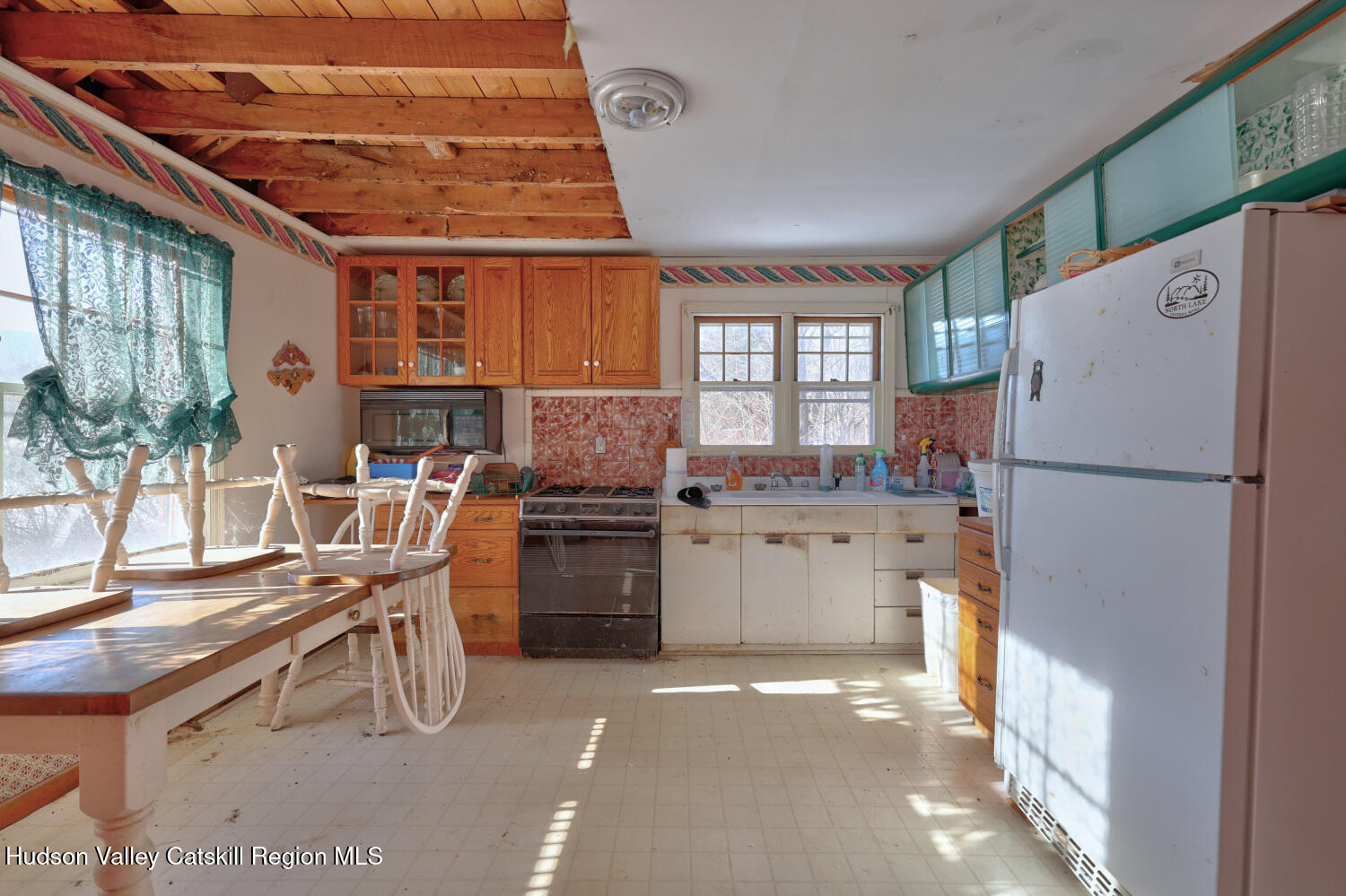 42 Old Rte 23 Cairo, NY 12413 - Photo 26 of 69 a kitchen with a refrigerator and a stove