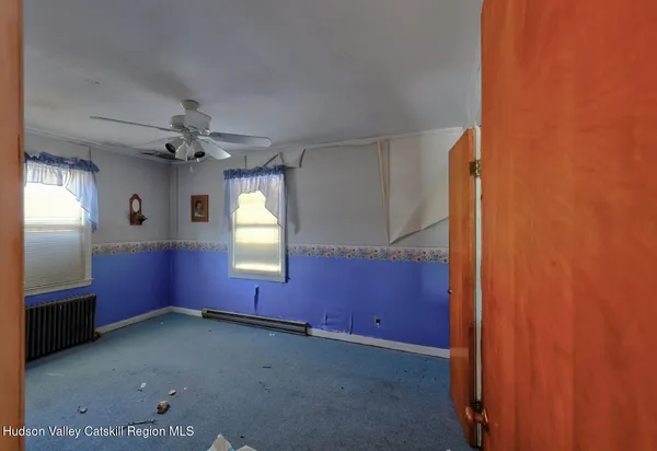 a bedroom with bed and a window