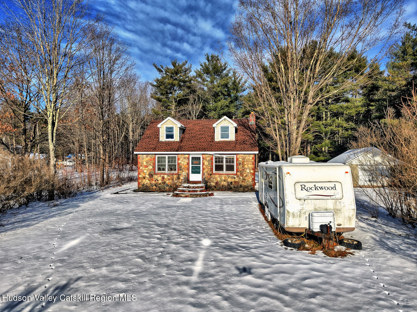 42 Old Rte 23 Cairo, NY 12413 - Photo 53 of 69 a view of a white house with a large tree and wooden fence