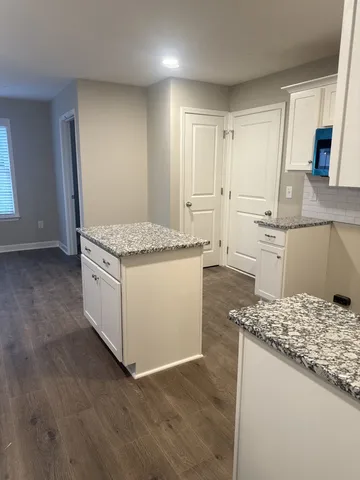 a kitchen with a sink stove and refrigerator