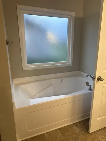 a bathroom with a bathtub