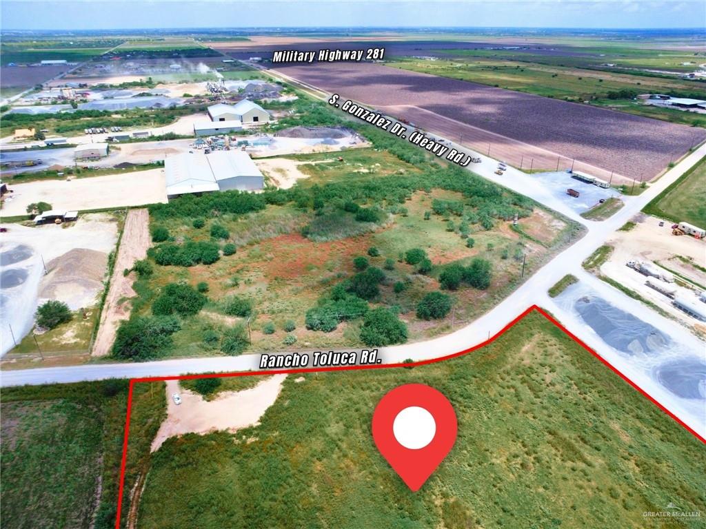 3 Rancho Toluca Road Weslaco, TX 78596 - Photo 4 of 6 a view of a back yard with a table and chair
