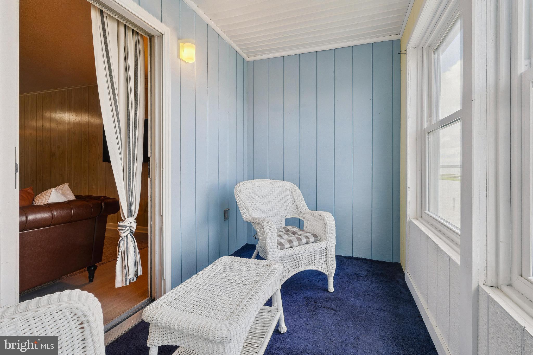 120 53rd Street, Unit H30102 Ocean City, MD 21842 - Photo 13 of 53 a view of a hallway with chairs and a window