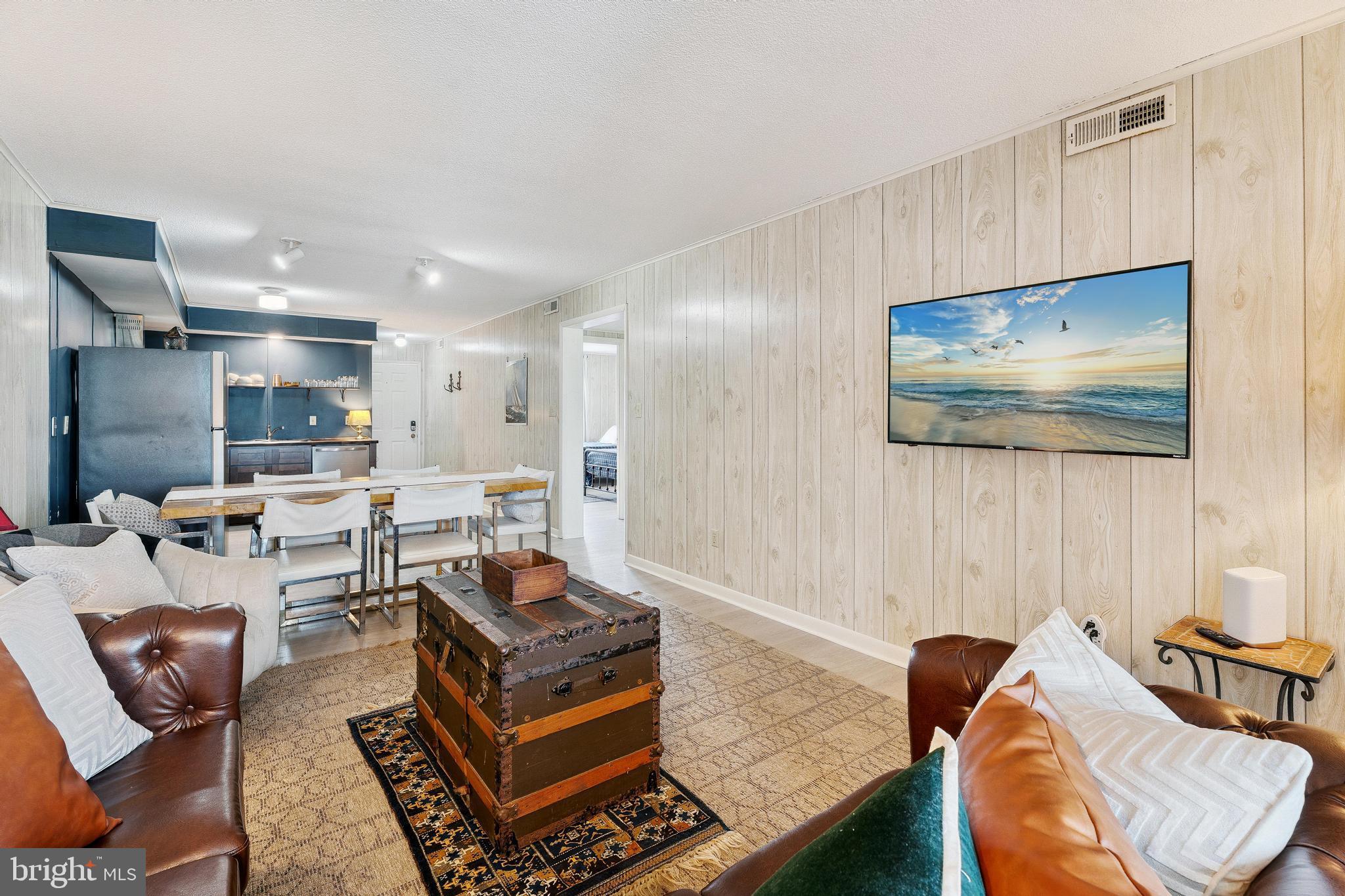 120 53rd Street, Unit H30102 Ocean City, MD 21842 - Photo 14 of 53 a living room with furniture and a air conditioner vent