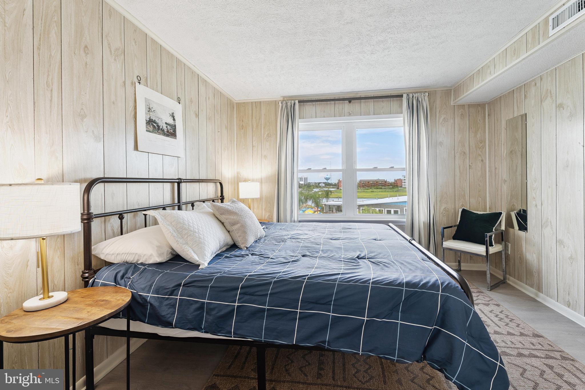 120 53rd Street, Unit H30102 Ocean City, MD 21842 - Photo 22 of 53 a bedroom with a bed and wooden floor