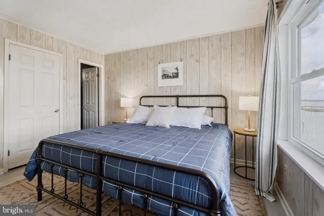 a view of hallway with wooden floor