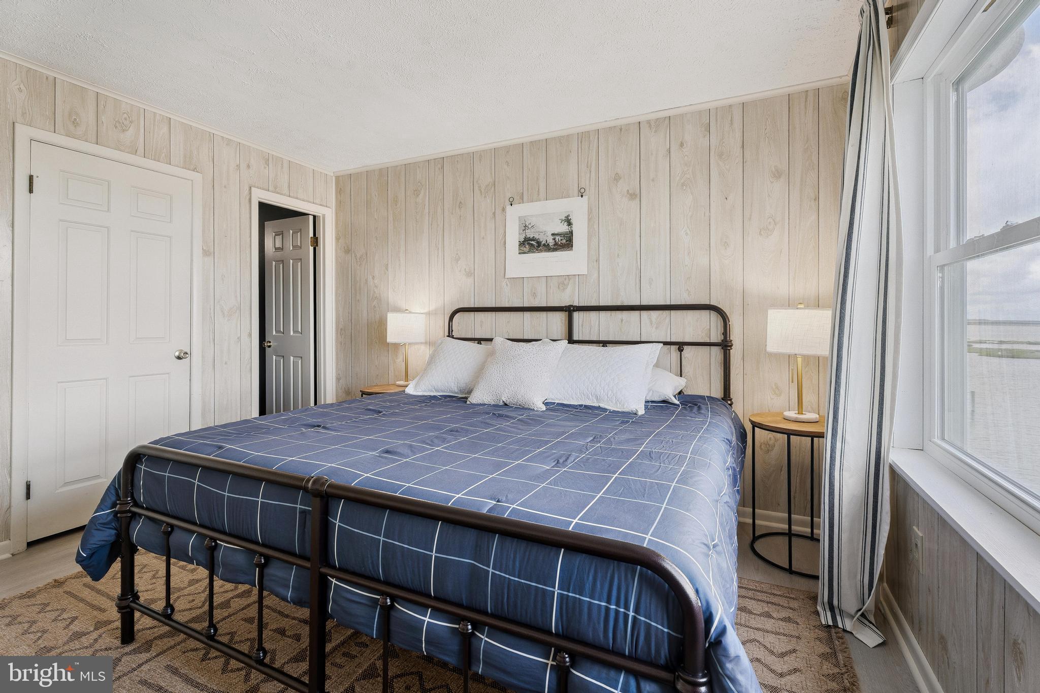 120 53rd Street, Unit H30102 Ocean City, MD 21842 - Photo 26 of 53 a bedroom with a bed and wooden floor