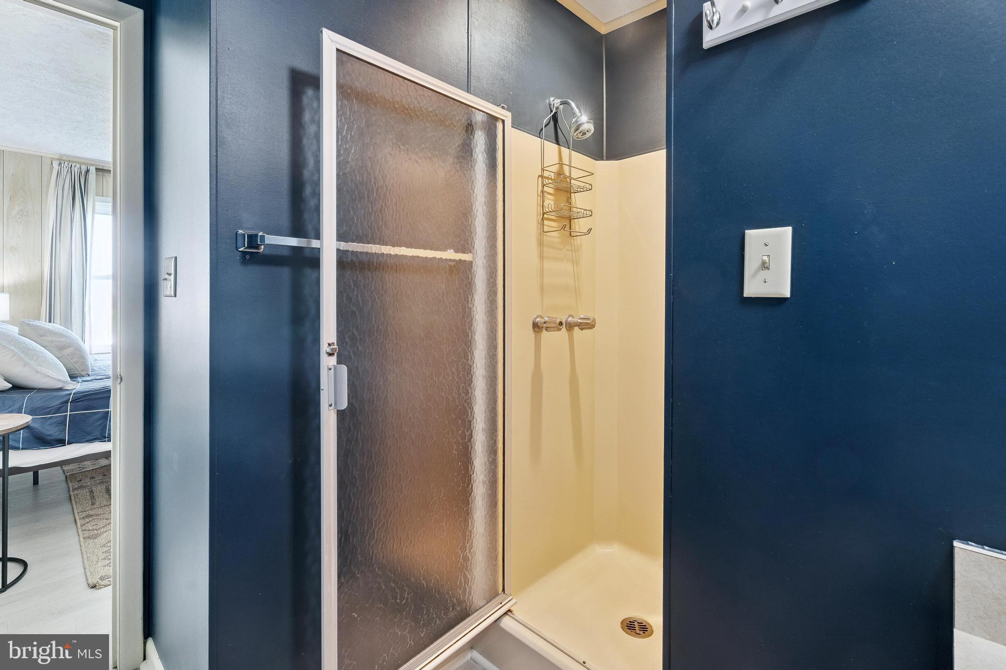 120 53rd Street, Unit H30102 Ocean City, MD 21842 - Photo 29 of 53 a bathroom with a shower and a glass door