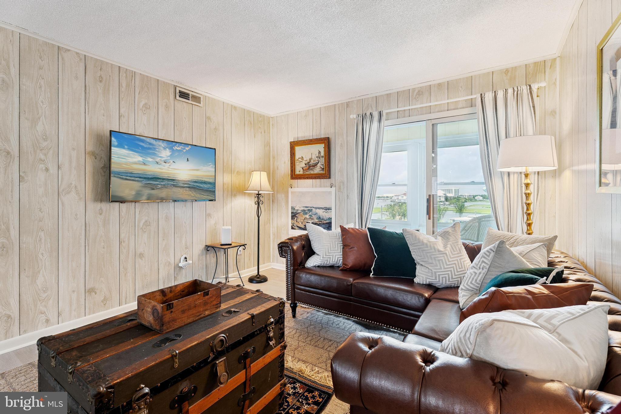120 53rd Street, Unit H30102 Ocean City, MD 21842 - Photo 3 of 53 a living room with furniture and a window