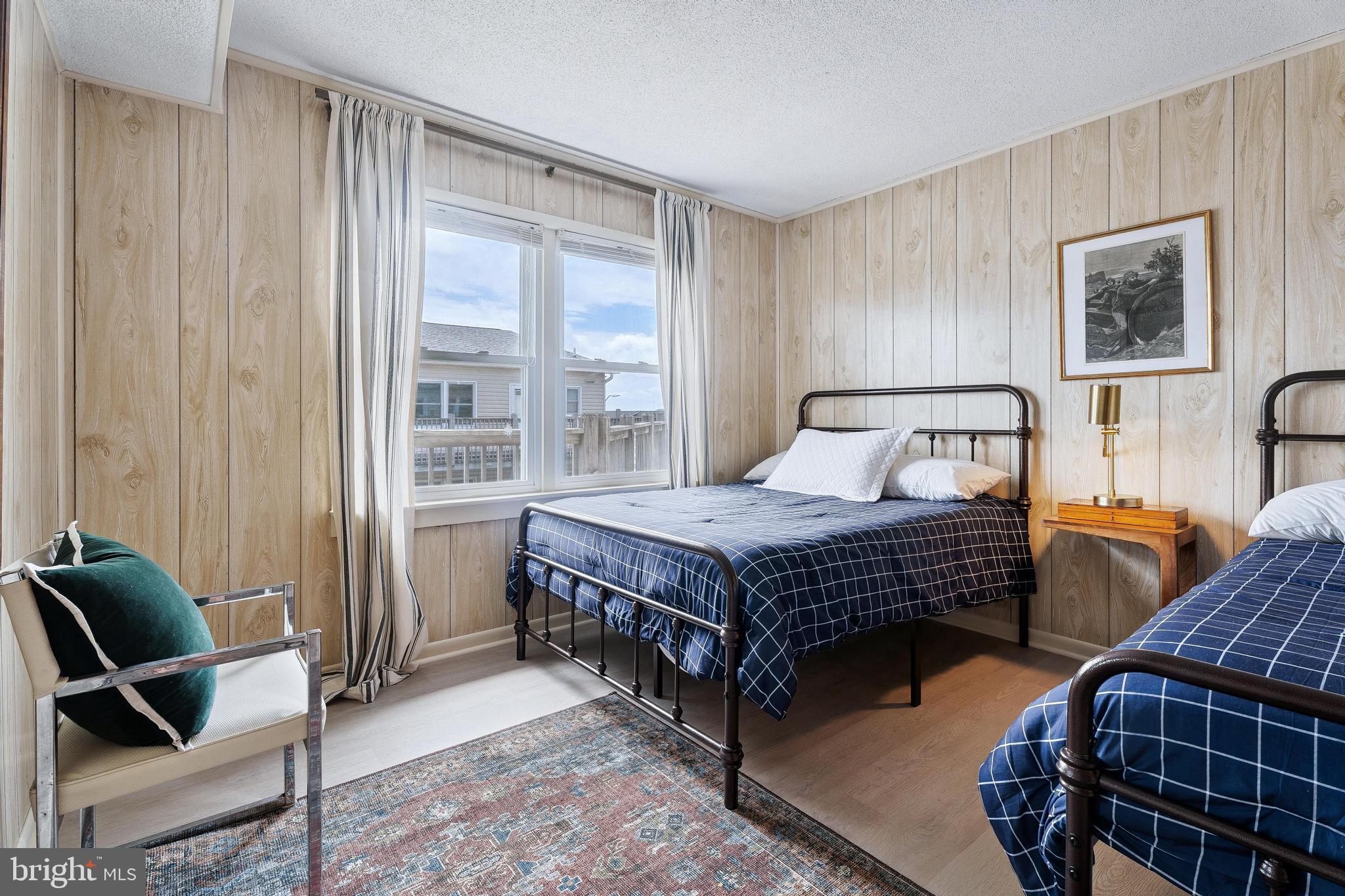 120 53rd Street, Unit H30102 Ocean City, MD 21842 - Photo 34 of 53 a bedroom with a bed and wooden floor