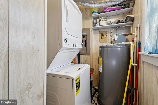 a view of a lake with boats and trees in the background