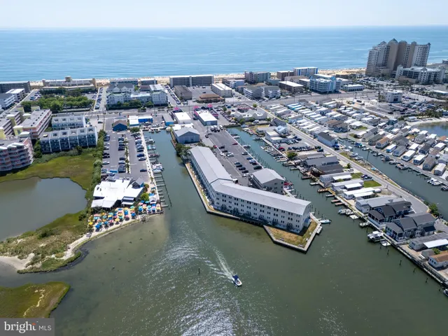 a large building with a lot of trees in front of it
