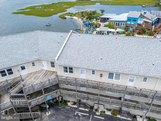 a view of a house with wooden fence