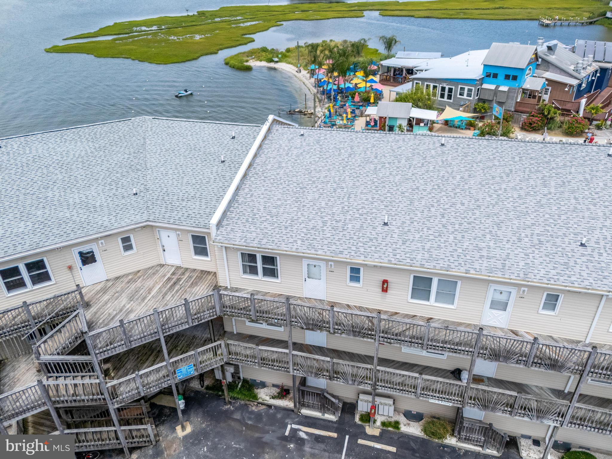 120 53rd Street, Unit H30102 Ocean City, MD 21842 - Photo 48 of 53 a large building with a lot of trees in front of it