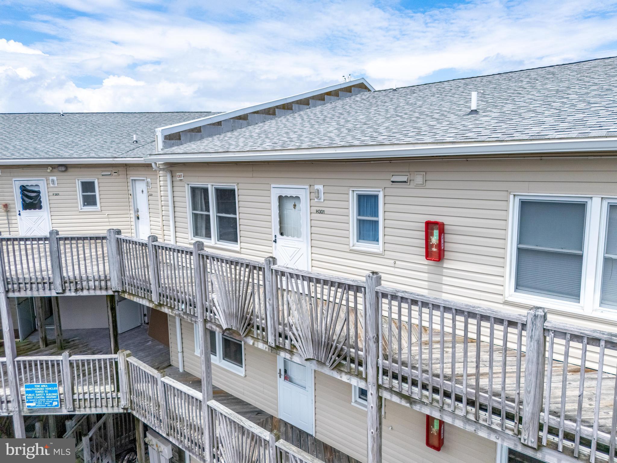 120 53rd Street, Unit H30102 Ocean City, MD 21842 - Photo 50 of 53 a view of a house with wooden fence